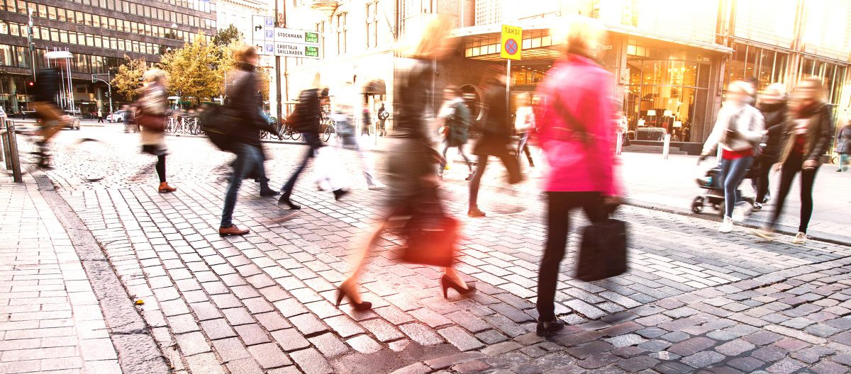 Blurred people in motion in a pedestrian street